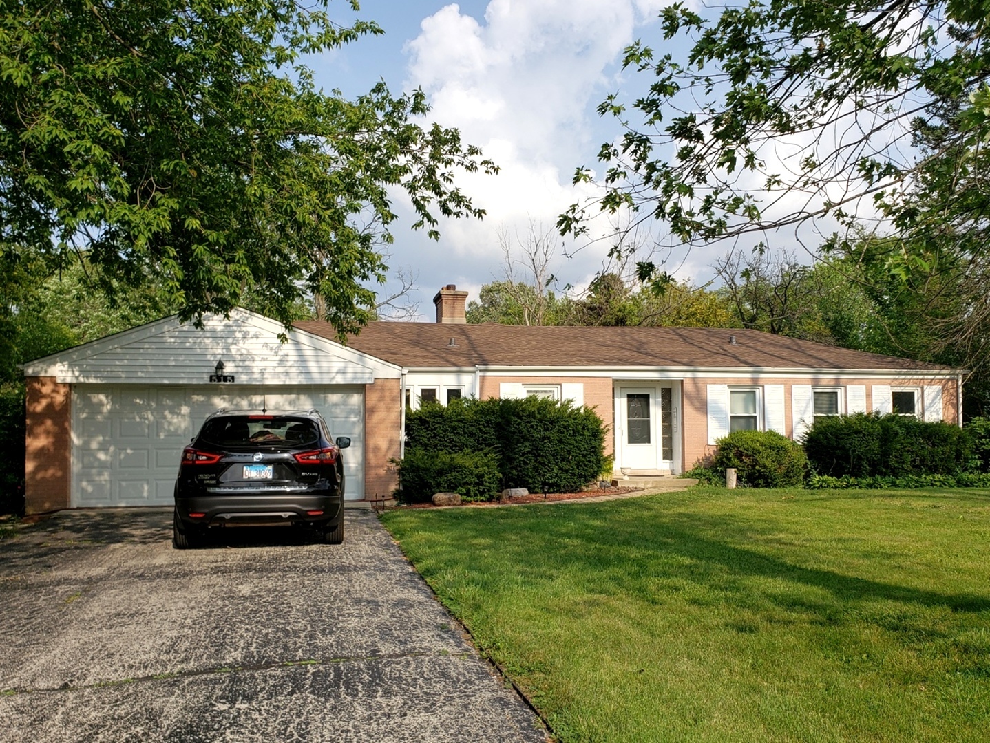 515 Warren Road Glenview, IL 60025 - Photo 1 of 11 a car parked in front of a house