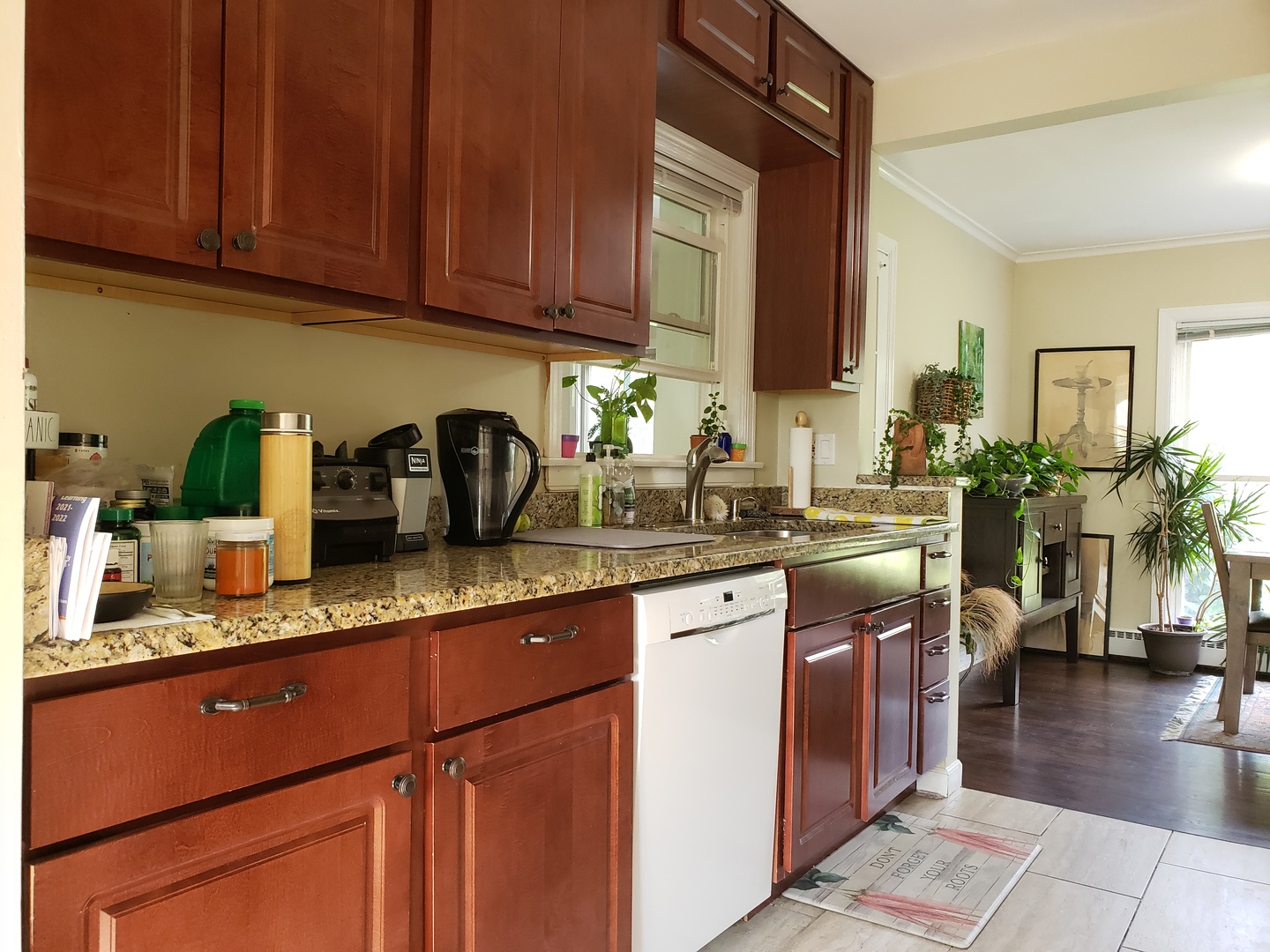 515 Warren Road Glenview, IL 60025 - Photo 7 of 11 a kitchen with granite countertop a sink a stove and cabinets