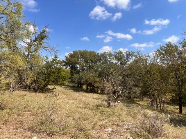 a view of a lake with a house in the background