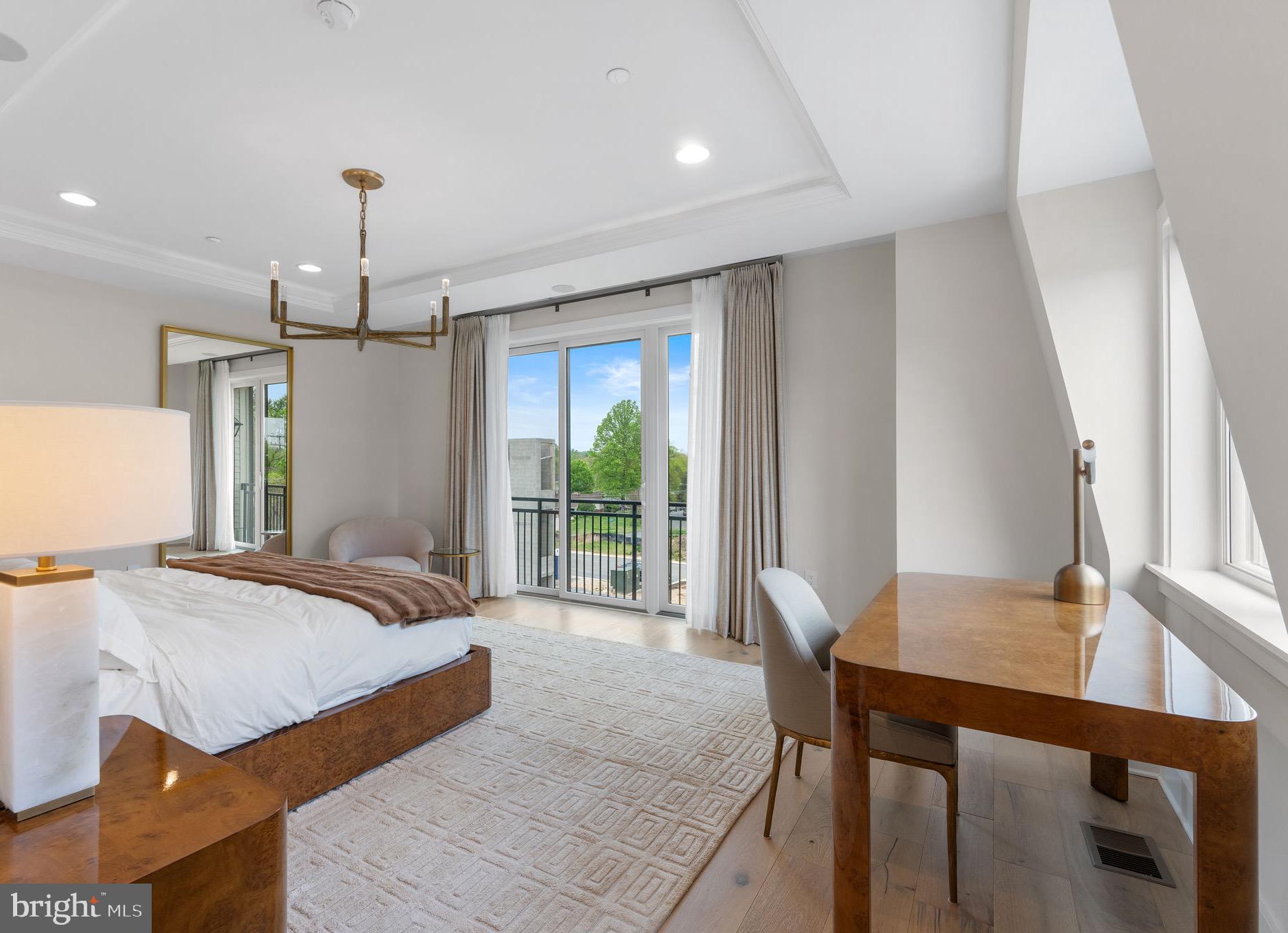 1622 Chain Bridge Road McLean, VA 22101 - Photo 20 of 72 a spacious bedroom with a bed and a table
