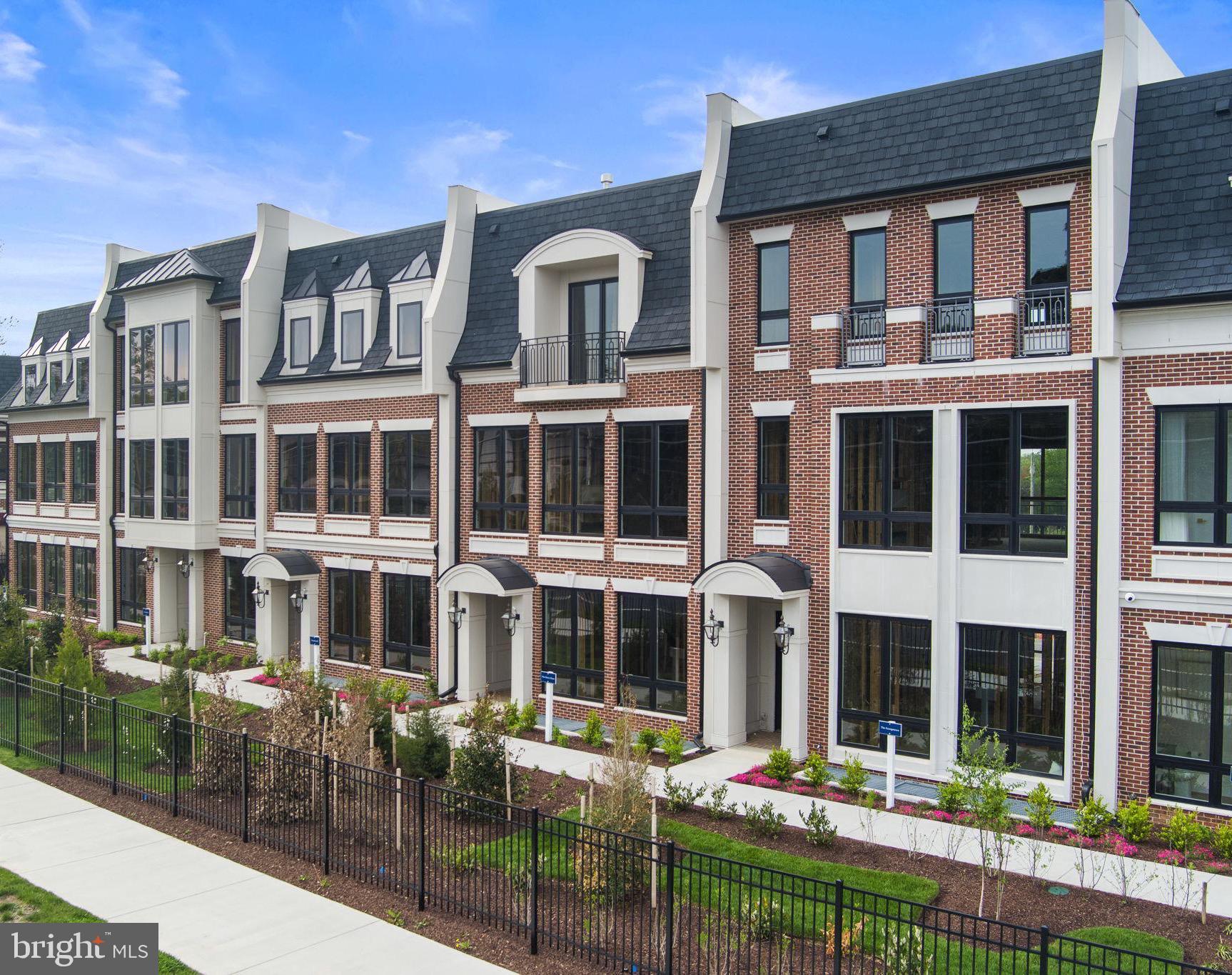 1622 Chain Bridge Road McLean, VA 22101 - Photo 2 of 72 a front view of multi story residential apartment building with a yard