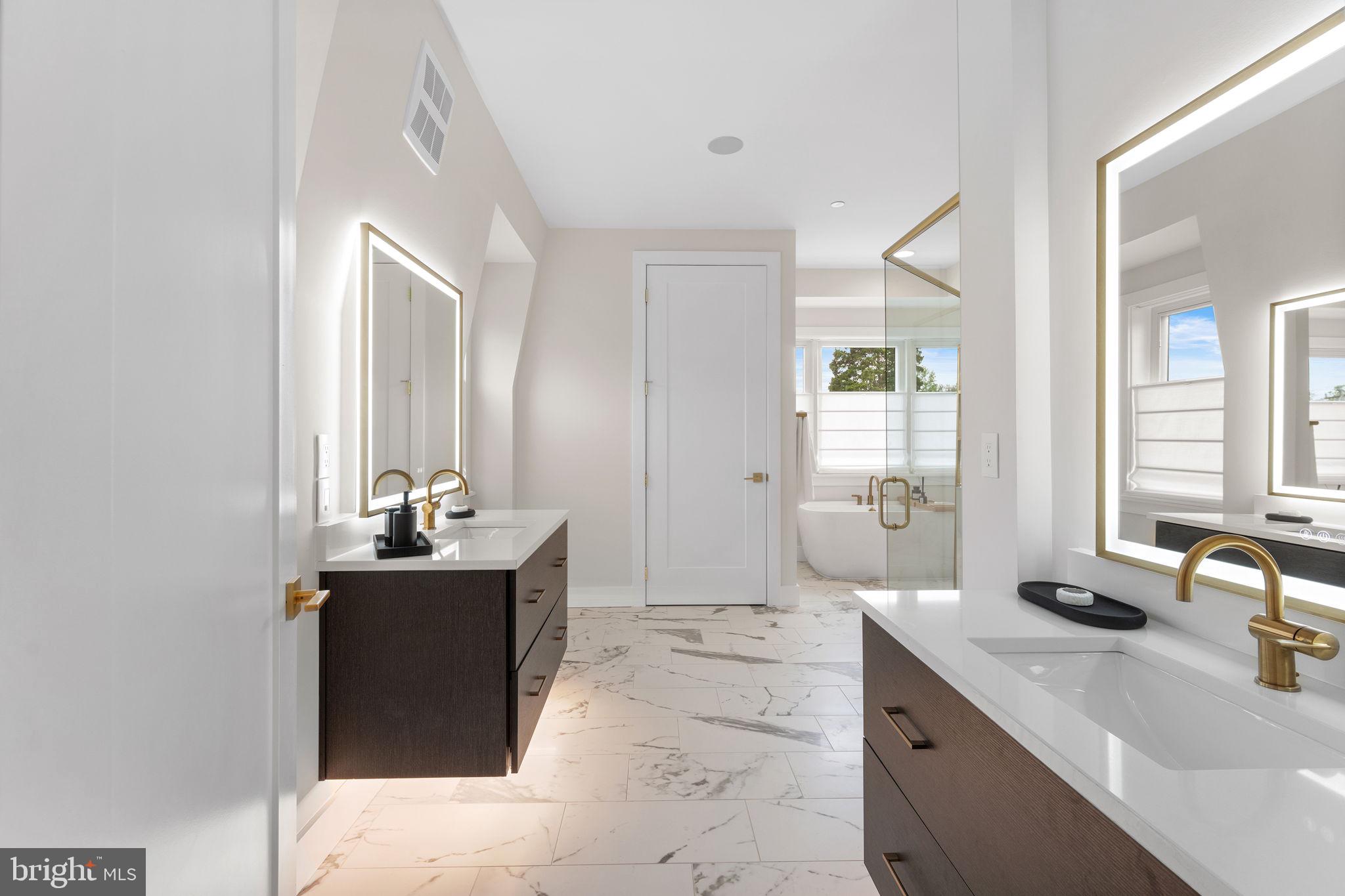 1622 Chain Bridge Road McLean, VA 22101 - Photo 26 of 72 a spacious bathroom with double vanity and two mirrors