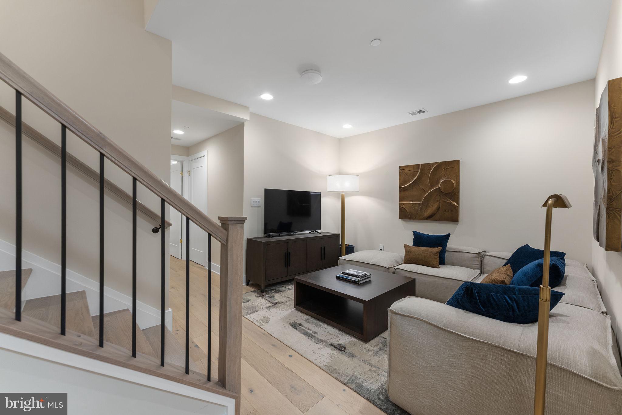 1622 Chain Bridge Road McLean, VA 22101 - Photo 33 of 72 a living room with furniture and a flat screen tv