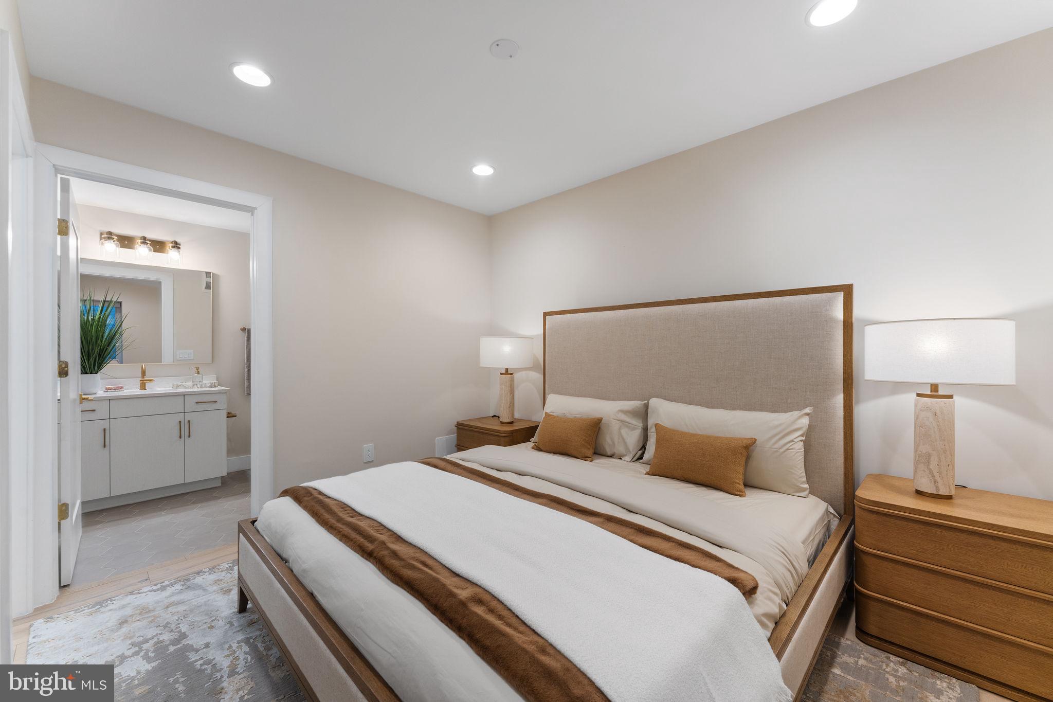 1622 Chain Bridge Road McLean, VA 22101 - Photo 35 of 72 a bedroom with a bed and a large mirror