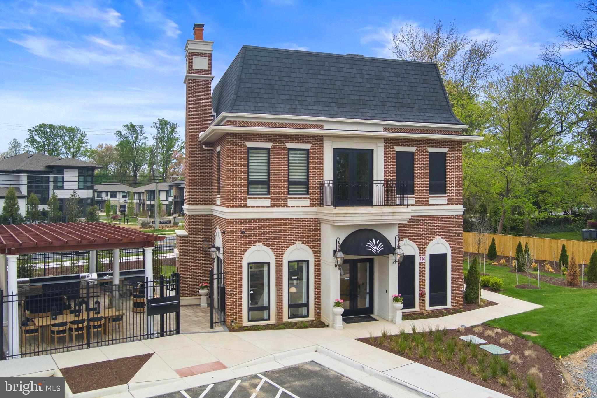 1622 Chain Bridge Road McLean, VA 22101 - Photo 40 of 72 a front view of a house with garden