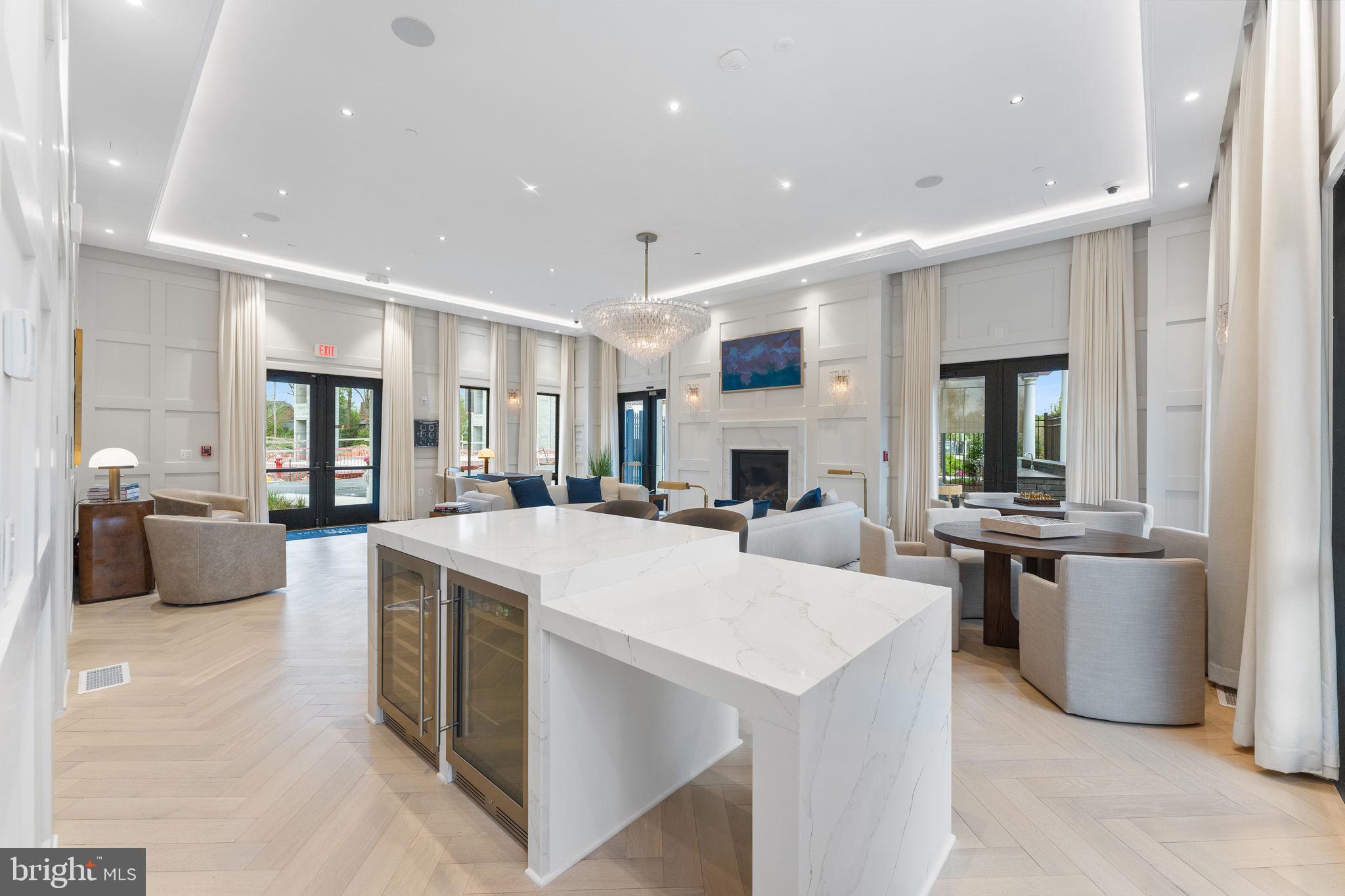 1622 Chain Bridge Road McLean, VA 22101 - Photo 42 of 72 a large white kitchen with stainless steel appliances