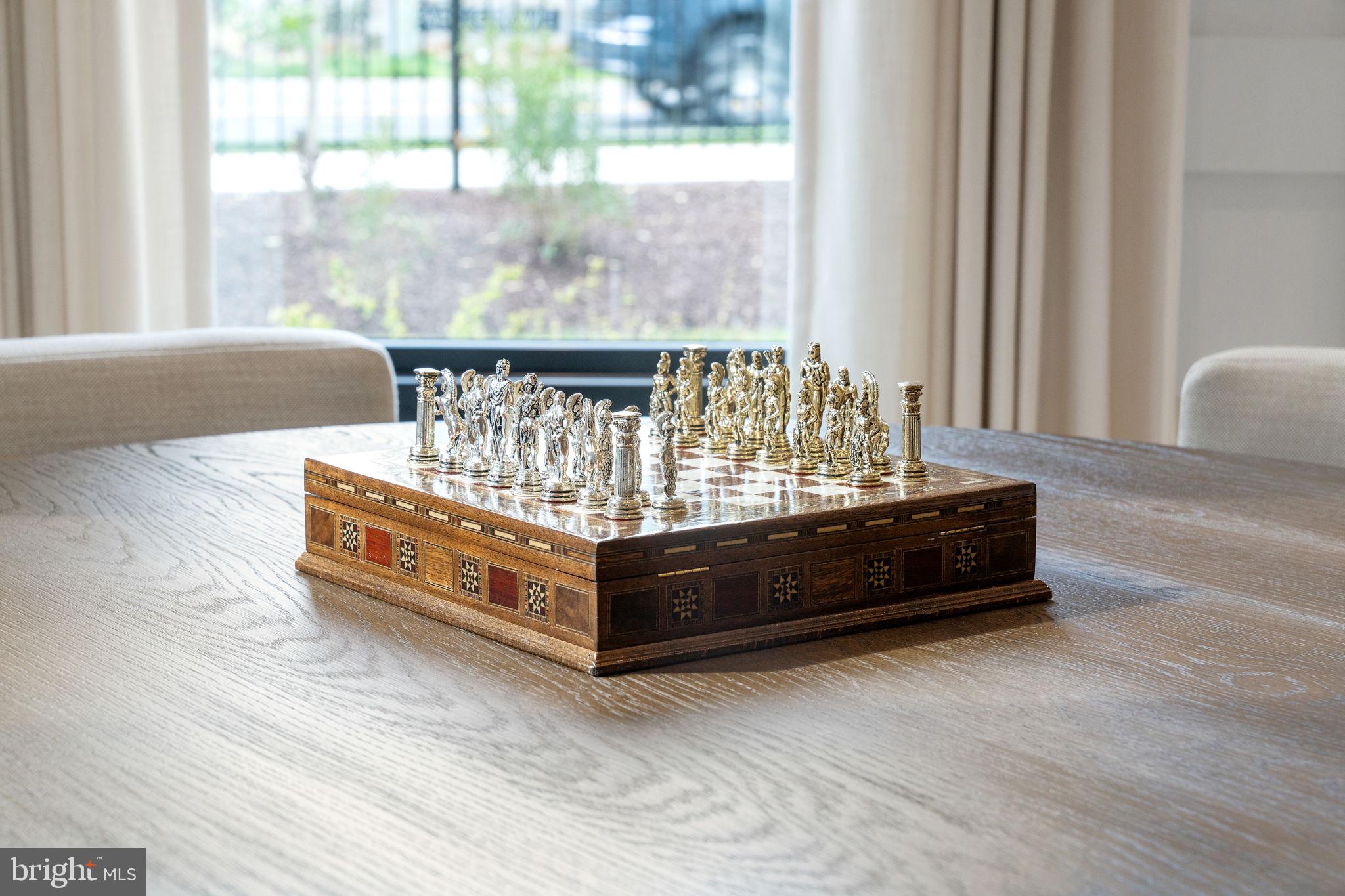 1622 Chain Bridge Road McLean, VA 22101 - Photo 46 of 72 a bed sitting in a bedroom next to a window