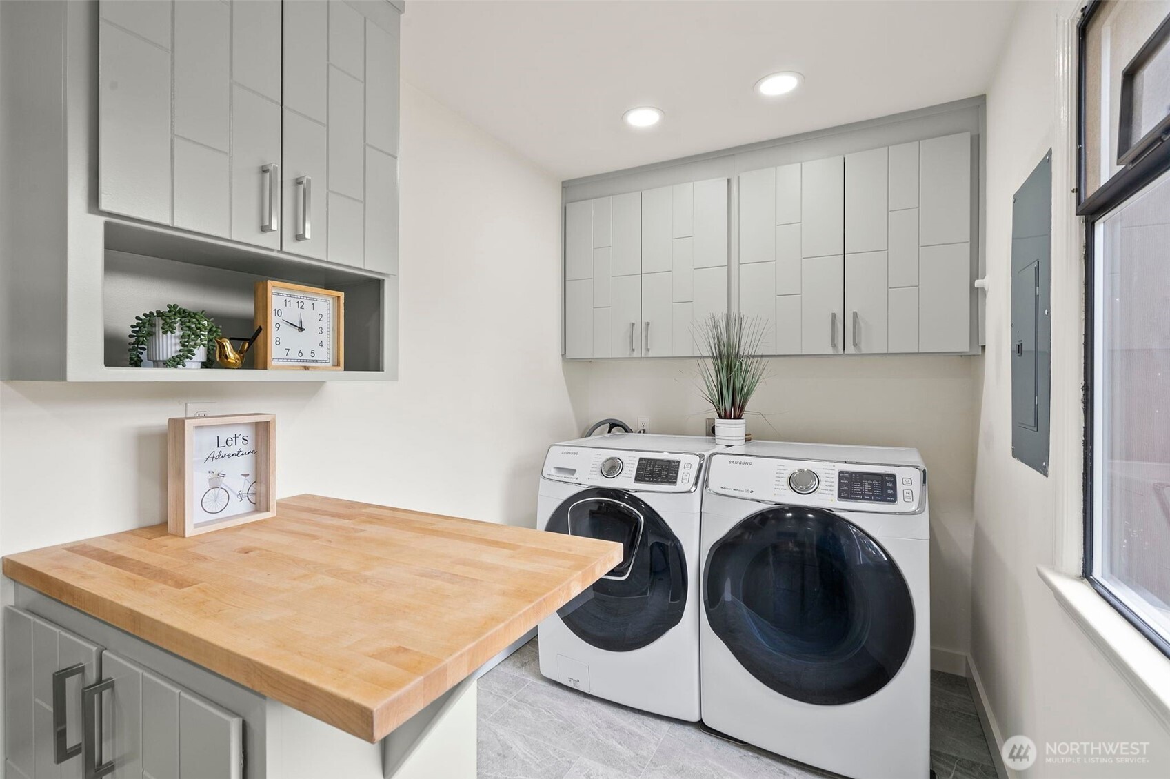 9747 Evanston Avenue North Seattle, WA 98103 - Photo 16 of 34 a utility room with sink dryer and washer