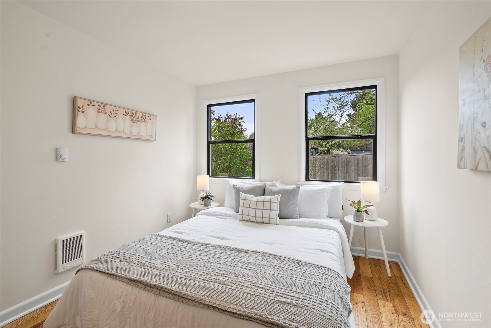 9747 Evanston Avenue North Seattle, WA 98103 - Photo 19 of 34 a bedroom with a bed and a window