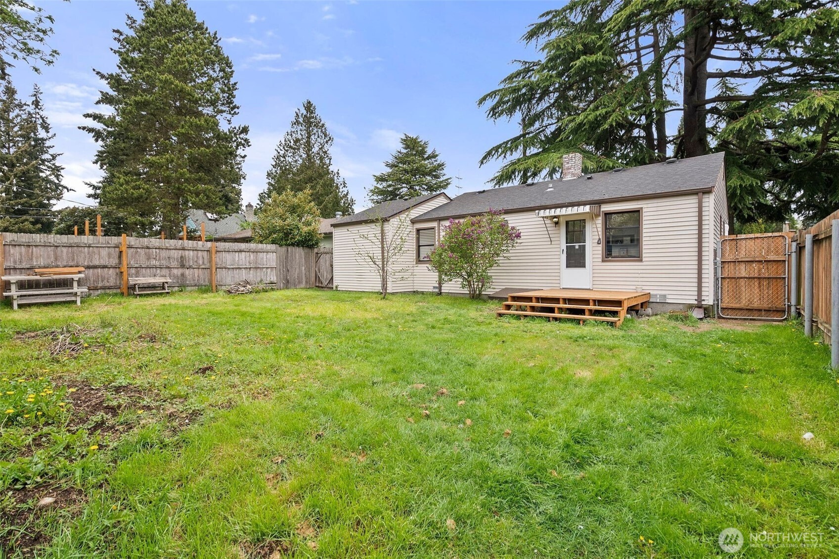9747 Evanston Avenue North Seattle, WA 98103 - Photo 27 of 34 a view of a backyard with a garden and plants