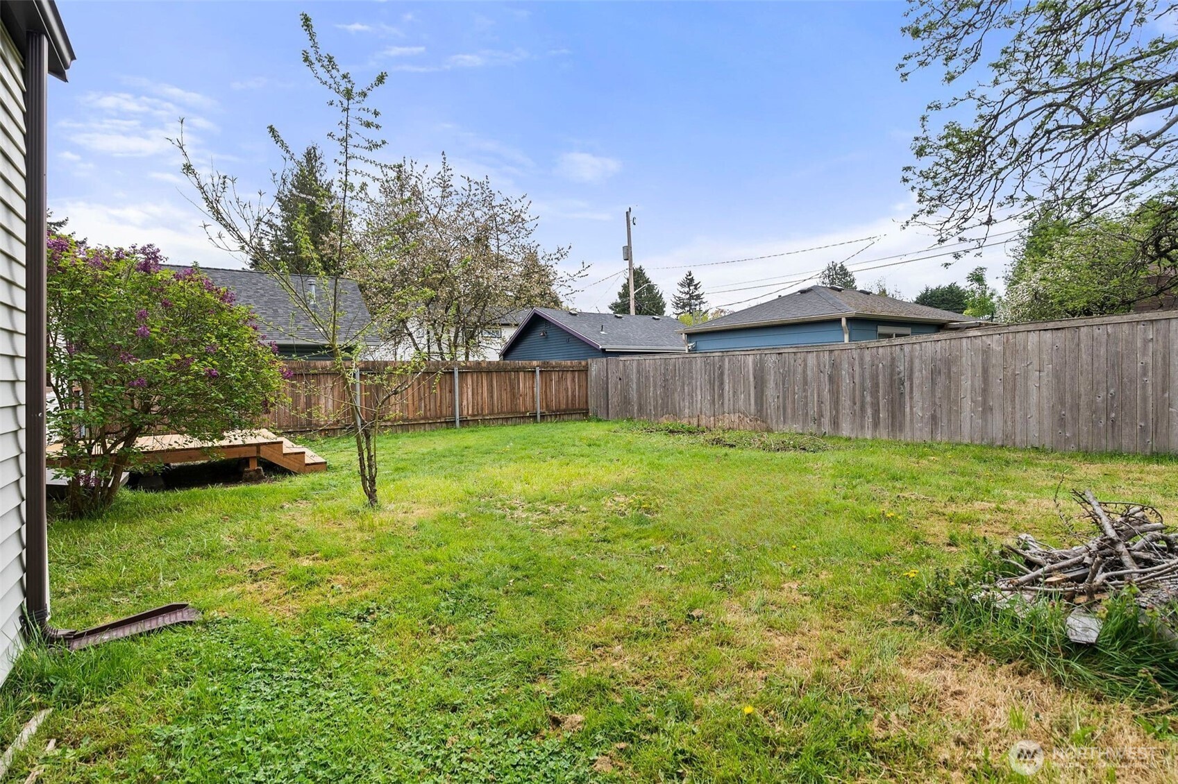 9747 Evanston Avenue North Seattle, WA 98103 - Photo 29 of 34 a view of a backyard with a garden and entertaining space