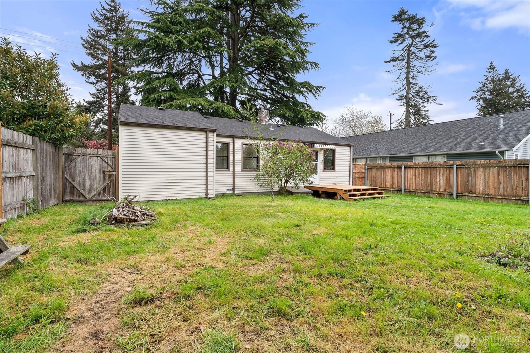 9747 Evanston Avenue North Seattle, WA 98103 - Photo 30 of 34 a front view of house with yard