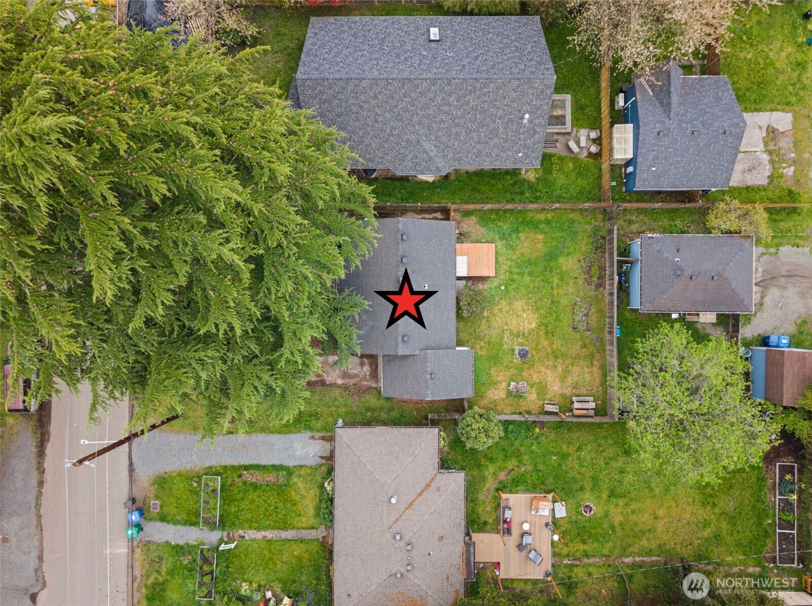 9747 Evanston Avenue North Seattle, WA 98103 - Photo 31 of 34 an aerial view of a house with a yard basket ball court and outdoor seating