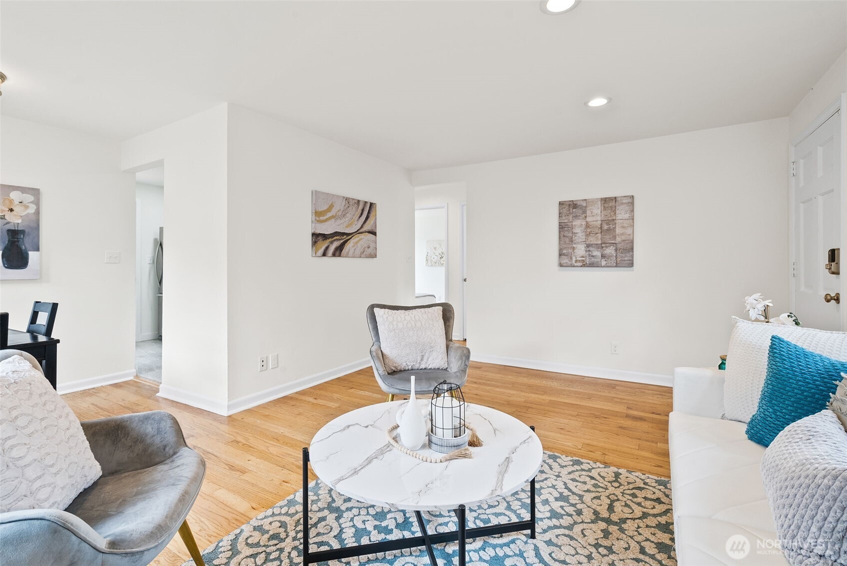 9747 Evanston Avenue North Seattle, WA 98103 - Photo 8 of 34 a living room with furniture and a wooden floor