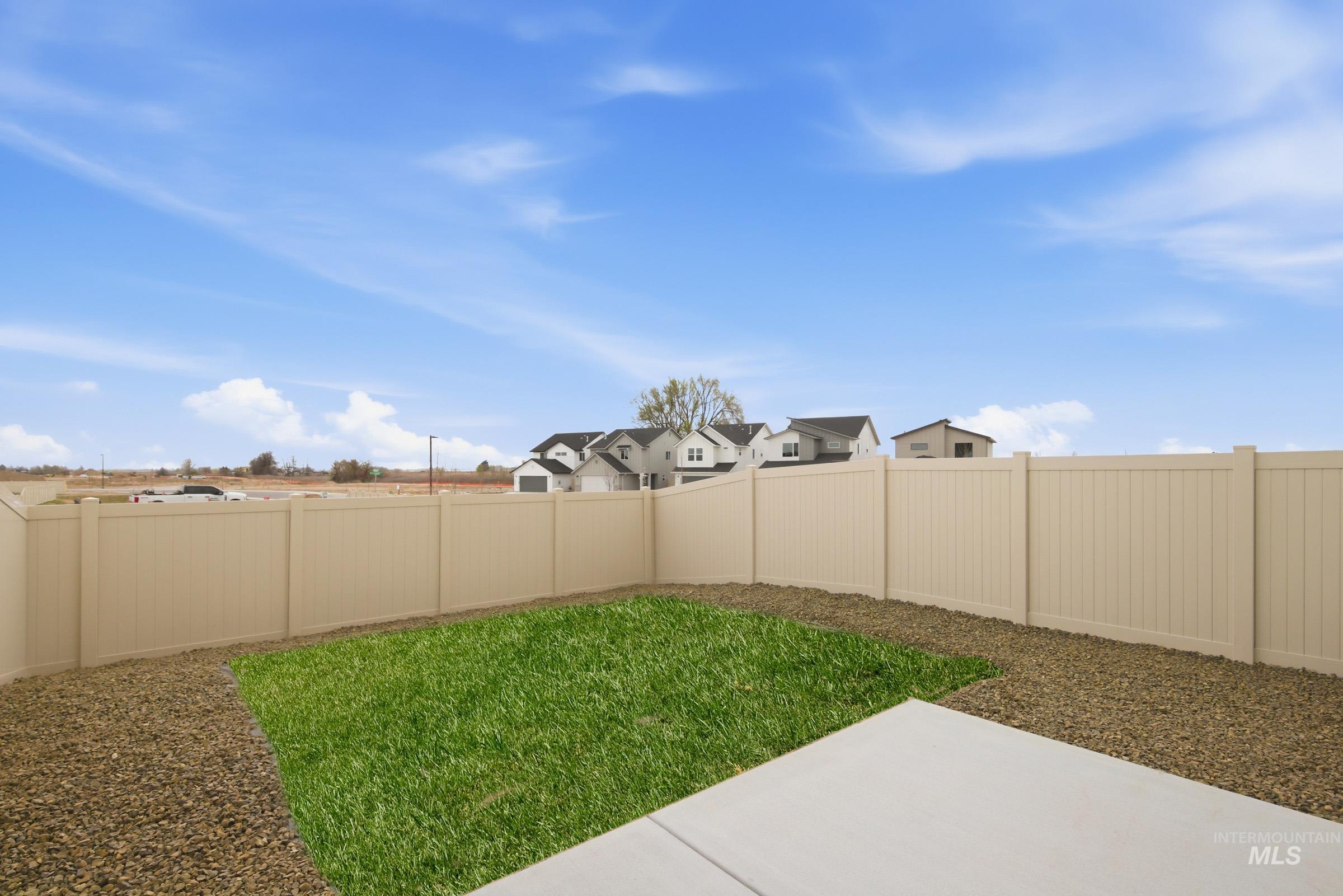 10784 Rutland Street Caldwell, ID 83605 - Photo 19 of 21 Fenced backyard featuring a residential view and a patio area