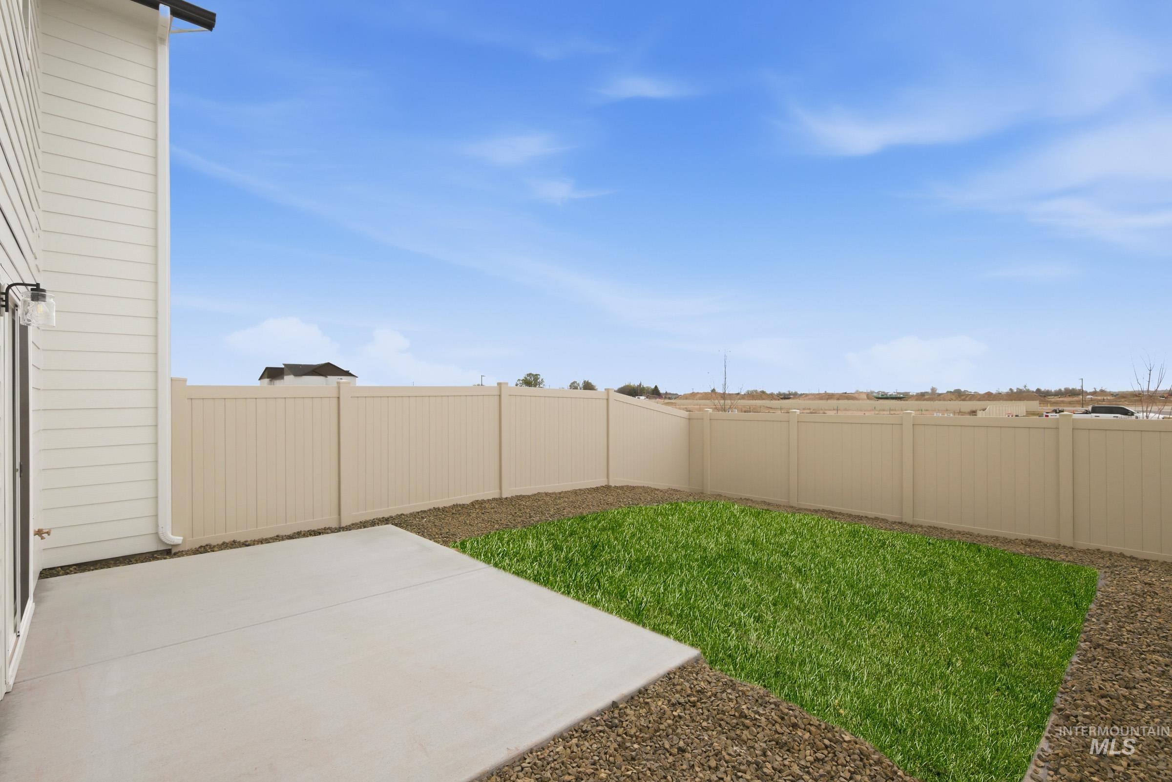 10784 Rutland Street Caldwell, ID 83605 - Photo 20 of 21 Fenced backyard with a patio