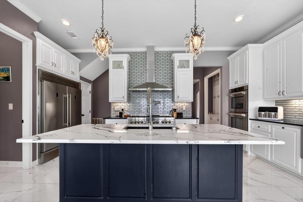 145 Private Road Pittsburg, TX 75686 - Photo 8 of 40 Kitchen with 56" Builtin Refrigerator, 4 Ovens, 6 Burner Gas Stovetop with Griddle, Pot Filler, Instant Cold and Hot Water