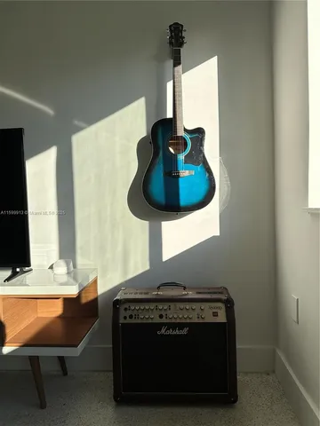 a living room with furniture and a lamp