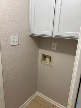 a bathroom with a granite countertop sink a toilet and mirror