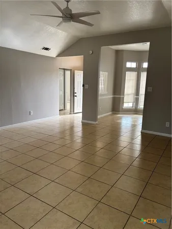 a kitchen with stainless steel appliances a stove a sink and a refrigerator