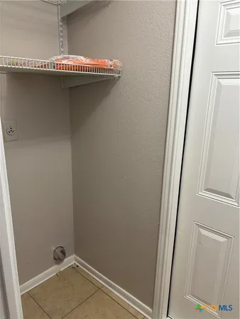 a spacious bathroom with a sink and a mirror