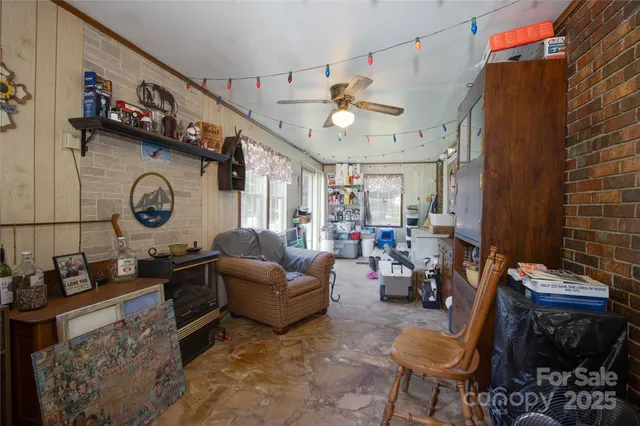 a living room with furniture a fireplace and a table