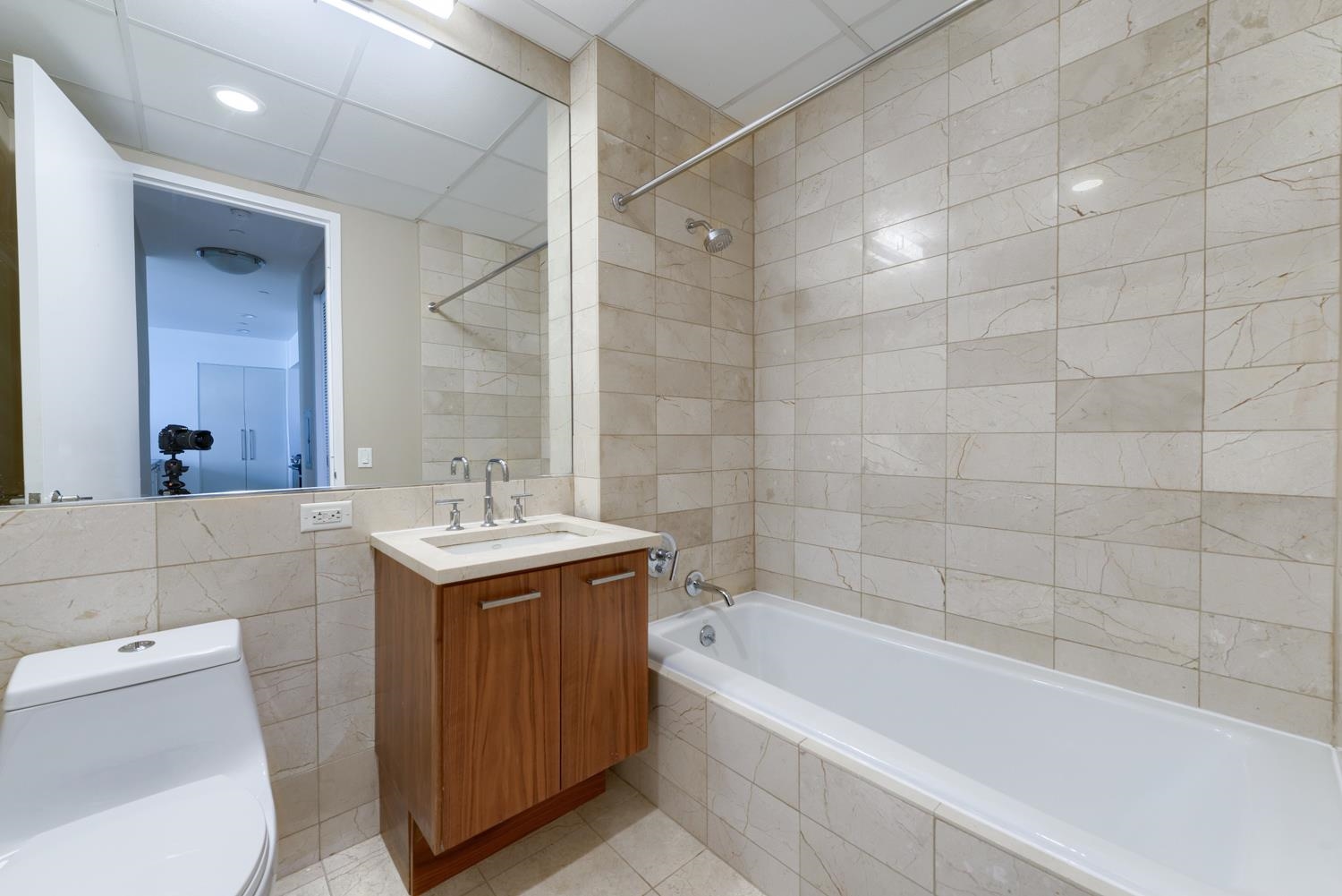 4 Beacon Way, Unit 1511 Jersey City, NJ 07304 - Photo 4 of 17 a bathroom with a sink a toilet and shower