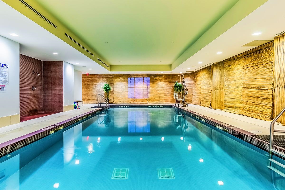 4 Beacon Way, Unit 1511 Jersey City, NJ 07304 - Photo 9 of 17 a kitchen with stainless steel appliances a large window