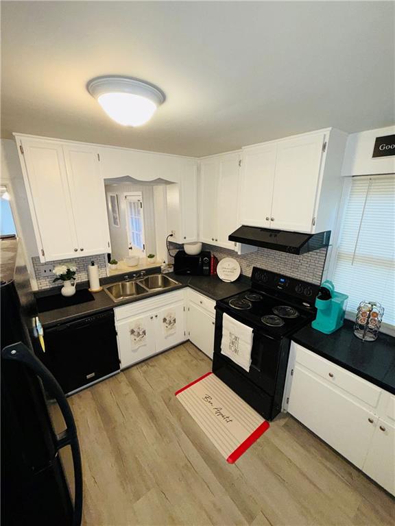 901 7th Avenue Albany, GA 31701 - Photo 5 of 14 a kitchen with a stove a sink and a refrigerator