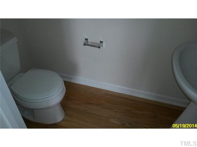 2028 Metacomet Way Raleigh, NC 27604 - Photo 11 of 12 a bathroom with a toilet a sink and mirror