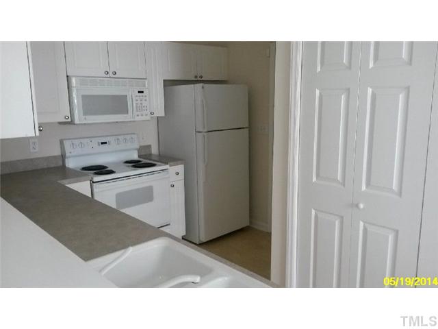 2028 Metacomet Way Raleigh, NC 27604 - Photo 6 of 12 a kitchen with a refrigerator and a sink