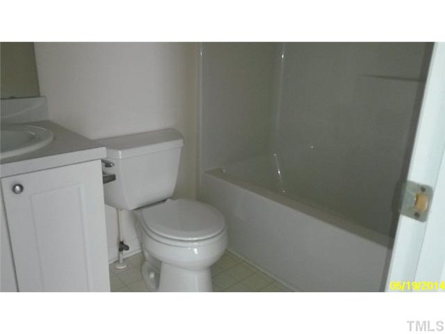 2028 Metacomet Way Raleigh, NC 27604 - Photo 8 of 12 a bathroom with a sink and a toilet