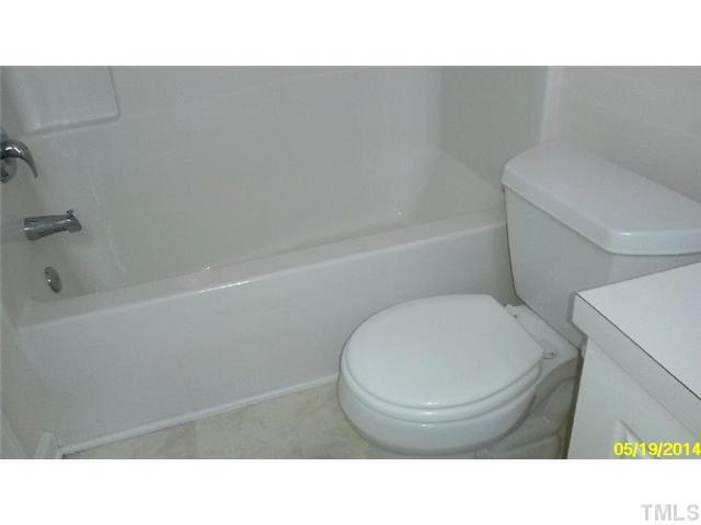 2028 Metacomet Way Raleigh, NC 27604 - Photo 10 of 12 a bathroom with a toilet and a tub