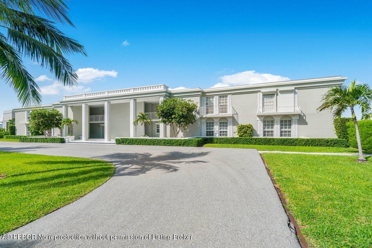 2170 Ibis Isle Road, Unit 3 Palm Beach, FL 33480 - Photo 11 of 12 a view of a house with a yard