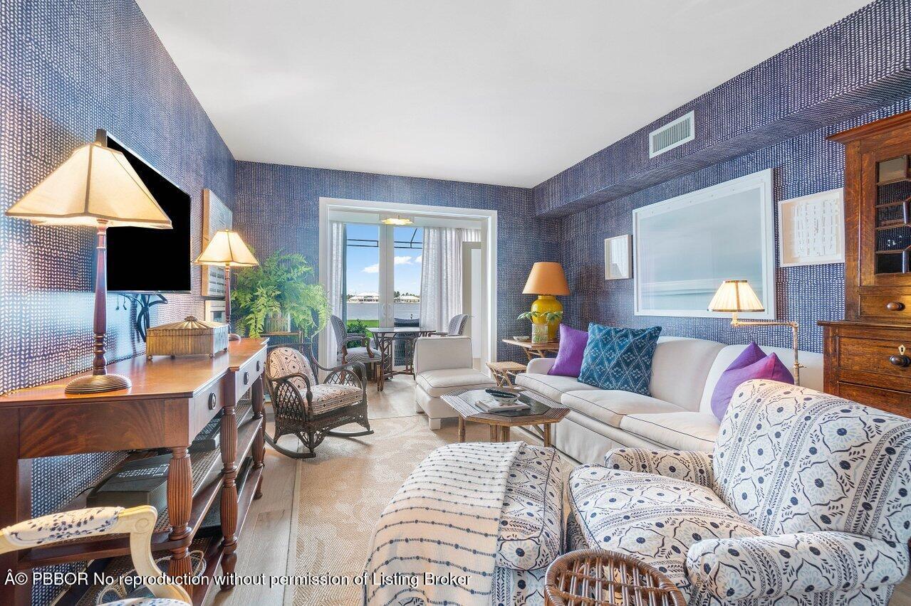2170 Ibis Isle Road, Unit 3 Palm Beach, FL 33480 - Photo 6 of 12 a living room with furniture and a flat screen tv