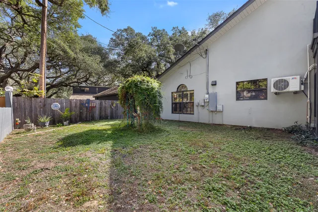 a backyard of a house with lots of green space