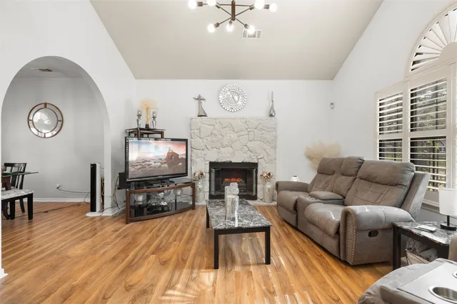 a living room with furniture and a fireplace