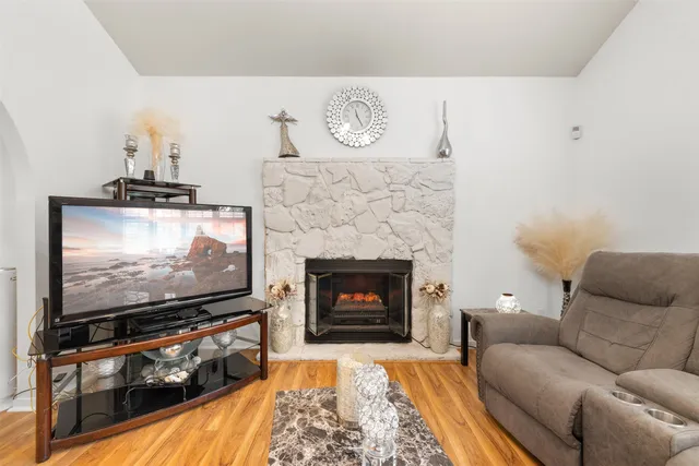 a living room with furniture and a fireplace