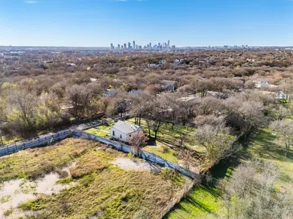 an aerial view of a house with a swimming pool