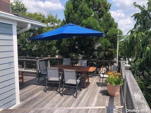 a view of a chairs and table in the patio
