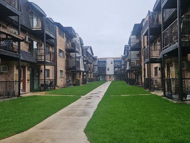 a view of a building with a yard