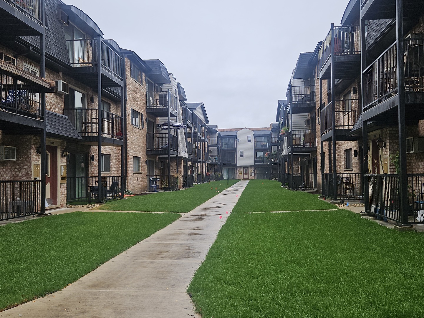 a view of a building with a yard