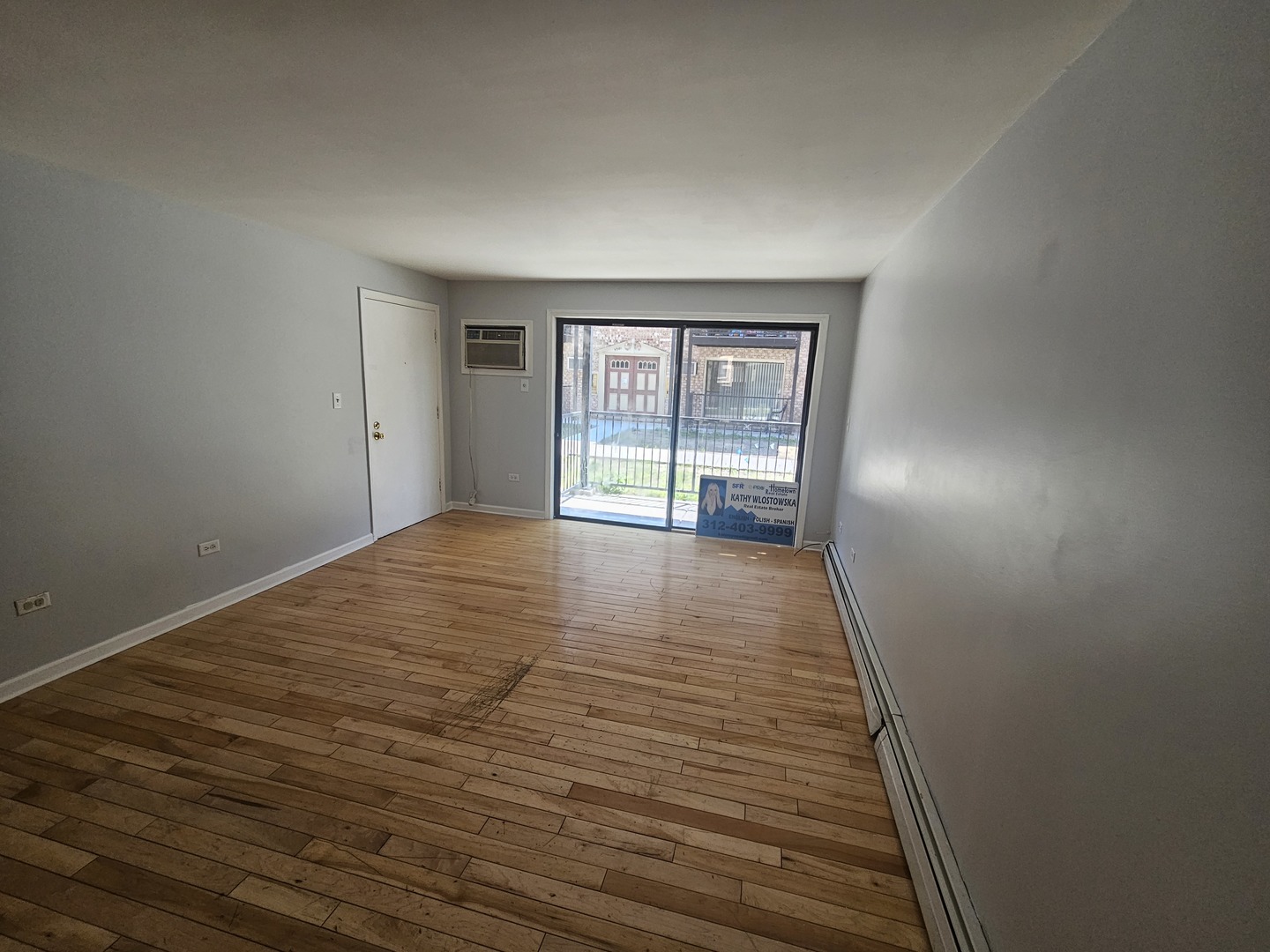 5349 North Delphia Avenue, Unit 150 Chicago, IL 60656 - Photo 12 of 16 wooden floor in an empty room with a window