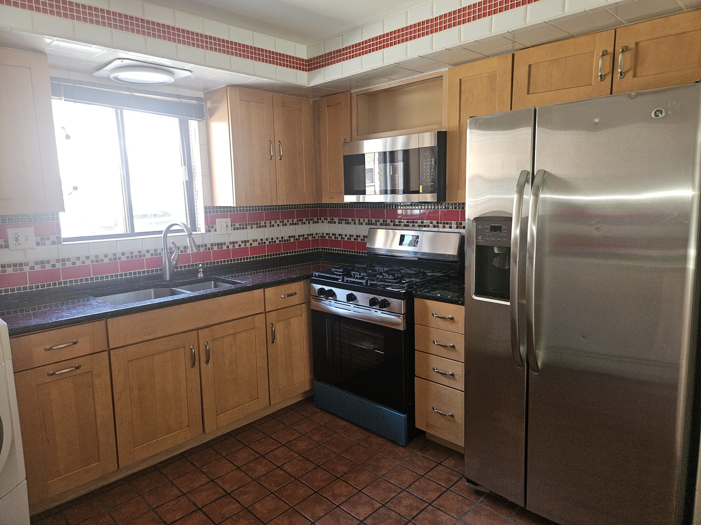 5349 North Delphia Avenue, Unit 150 Chicago, IL 60656 - Photo 4 of 16 a kitchen with stainless steel appliances granite countertop a refrigerator and a sink