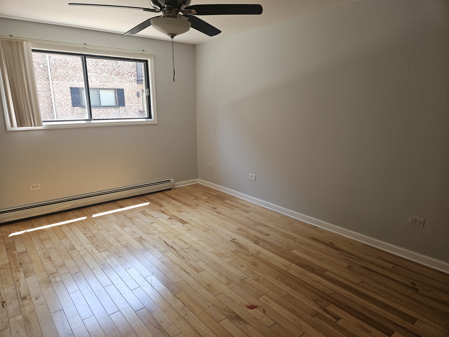 5349 North Delphia Avenue, Unit 150 Chicago, IL 60656 - Photo 7 of 16 a view of empty room with wooden floor