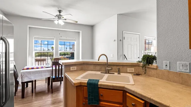 a living room with furniture fireplace and a window
