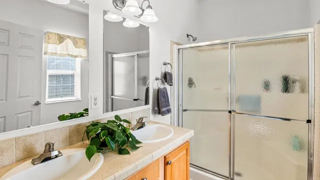 a bathroom with a sink vanity and a mirror