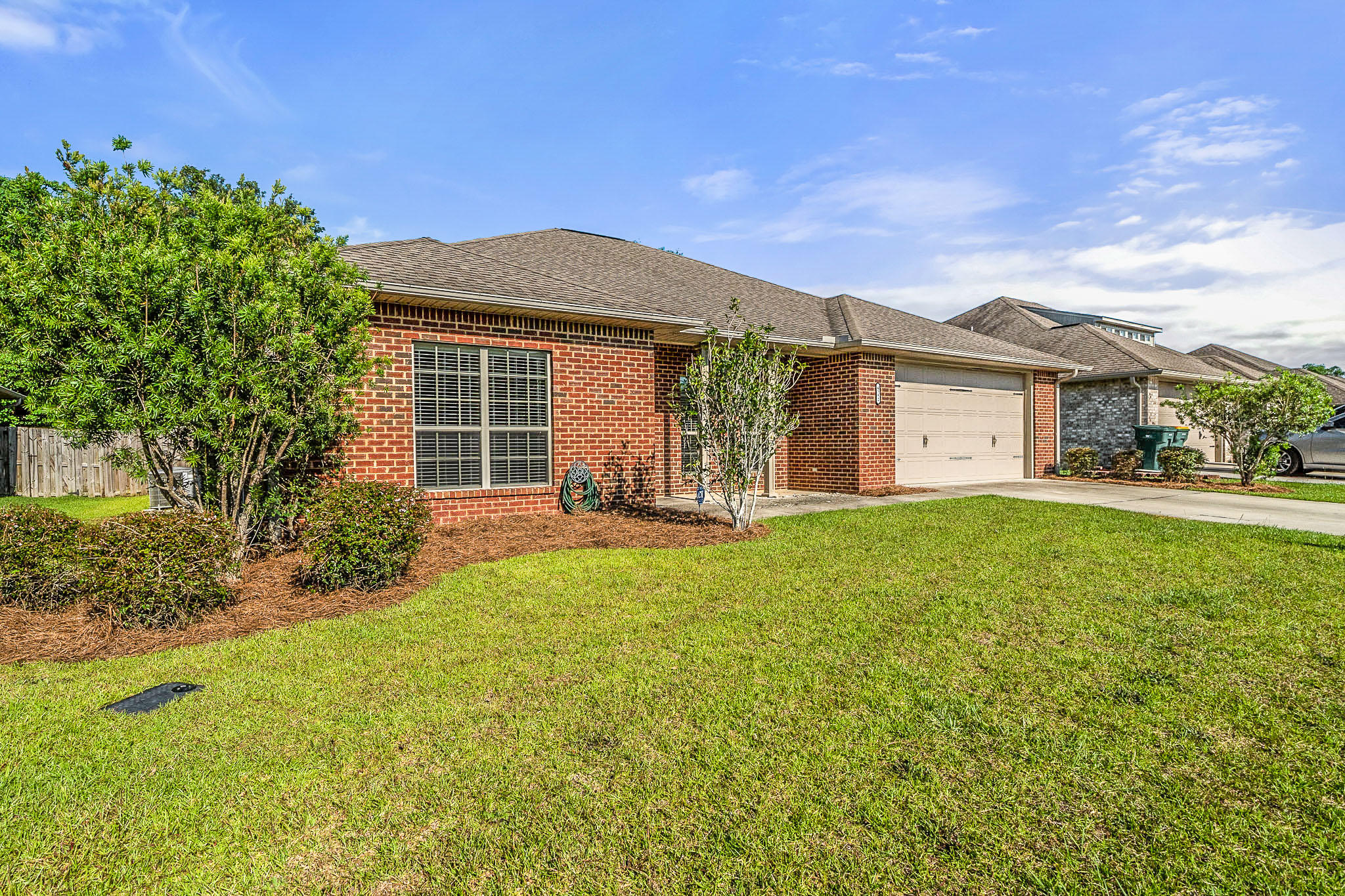 4592 Hermosa Road Crestview, FL 32539 - Photo 2 of 32 a front view of a house with garden