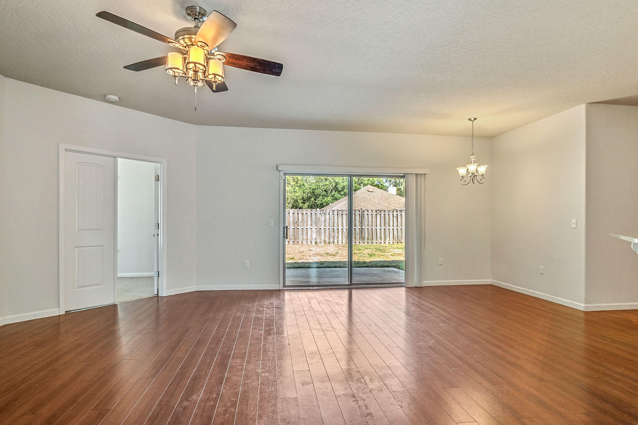 4592 Hermosa Road Crestview, FL 32539 - Photo 13 of 32 a view of empty room with wooden floor and fan