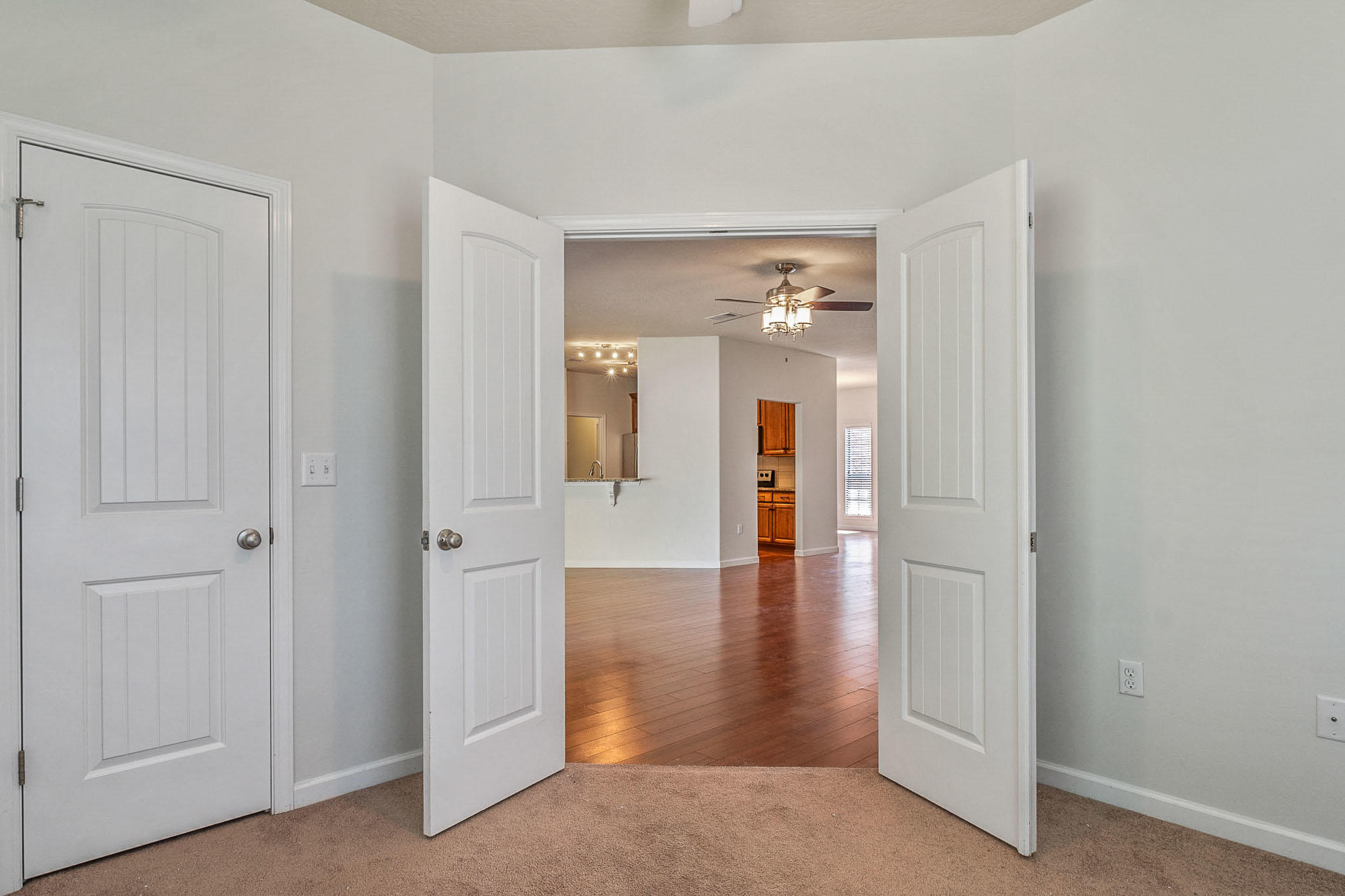 4592 Hermosa Road Crestview, FL 32539 - Photo 15 of 32 a view of a hallway with wooden floor